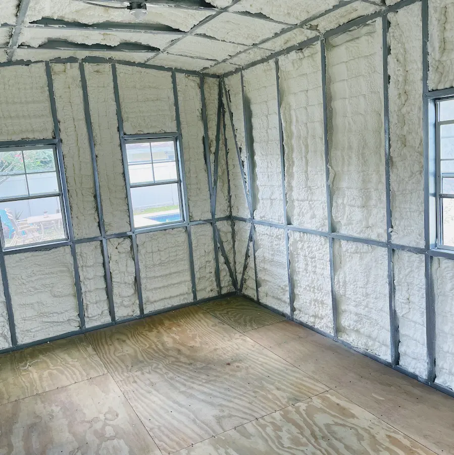 Closed-cell spray foam insulation applied to wall cavities in a residential project in Faribault